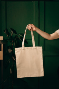 a person holding a tote bag